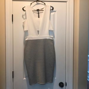 Super cute dress with side and middle cutouts!